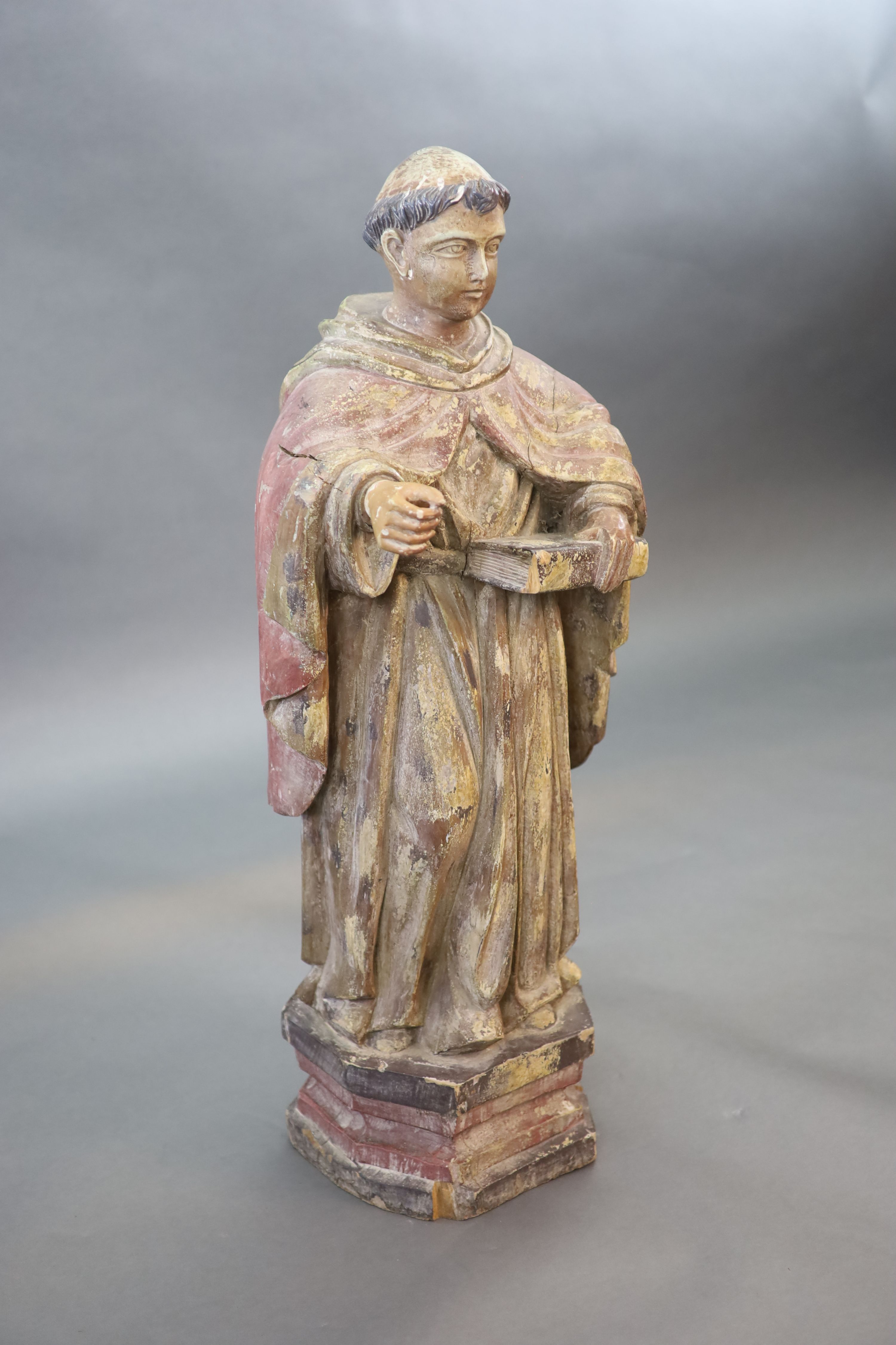 A large carved hardwood study of a standing monk or Saint, early 20th century 102cm high